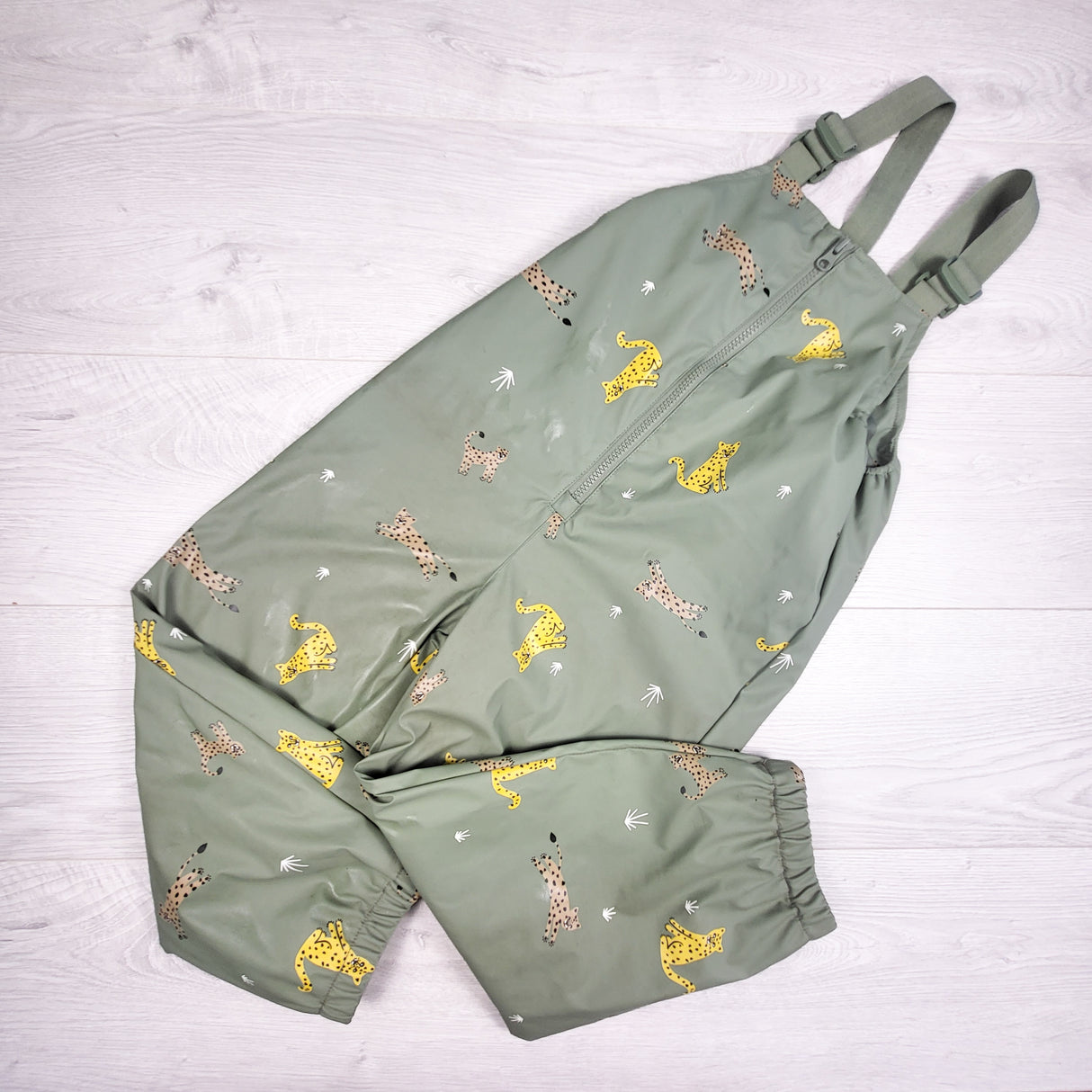 Rise Little Earthling green bib style rain pants with cheetahs. Size 5/6 - AS IS