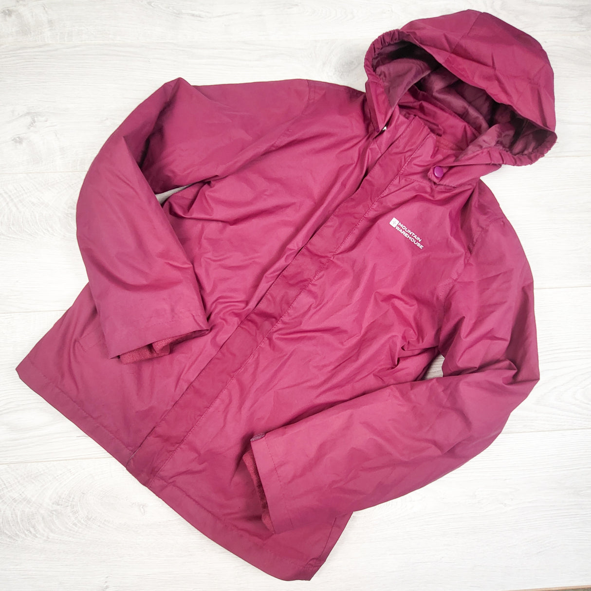 Mountain Warehouse dark pink water resistant jacket. Size 11/12
