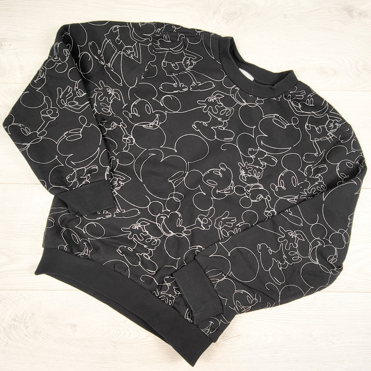 Disney Parks black Mickey Mouse print fleecey lined crewneck sweatshirt. Size 11/12