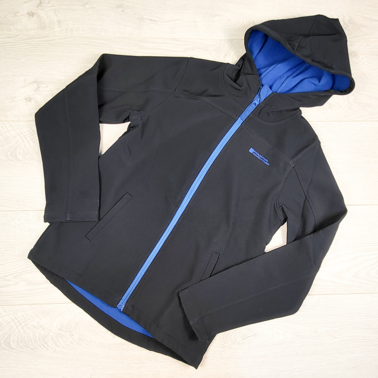 Mountain Warehouse navy fleecy lined soft shell hooded rain jacket. Size 11/12