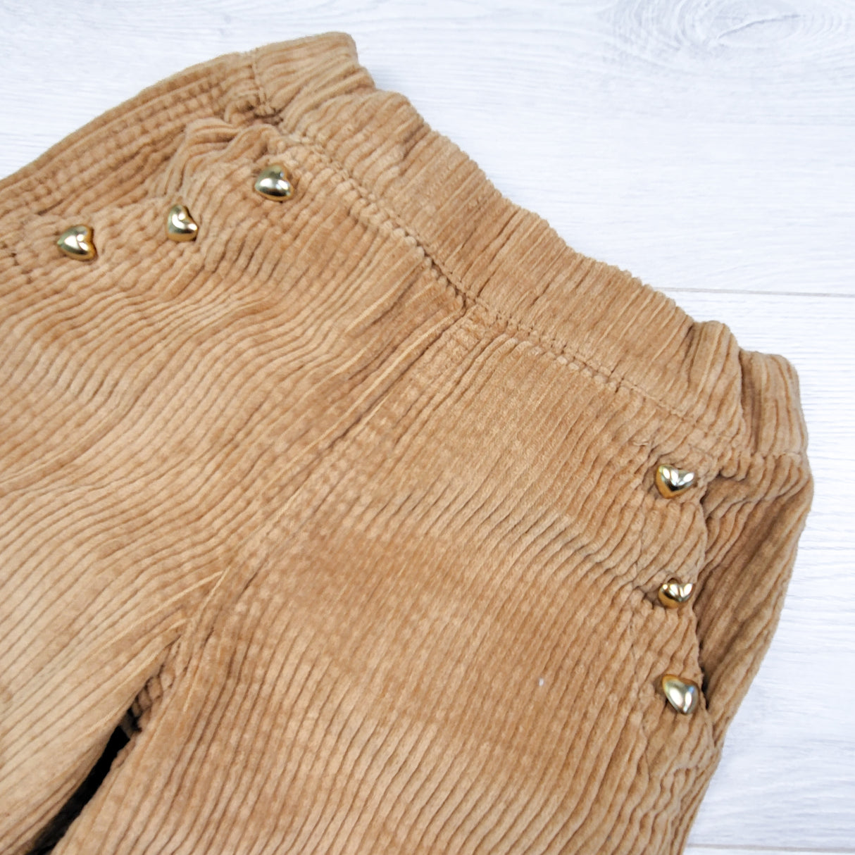 Old Navy tan wide leg corduroy pants with heart buttons. Size 2T