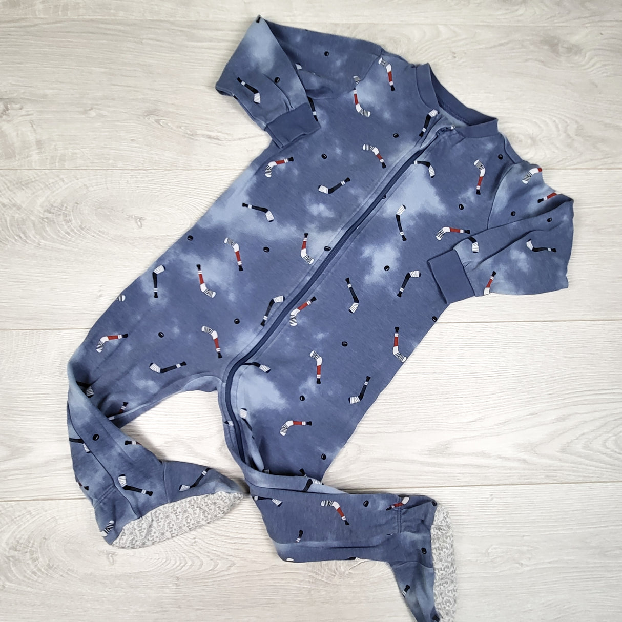 Pekkle blue zippered sleeper with hockey sticks. Size 3T