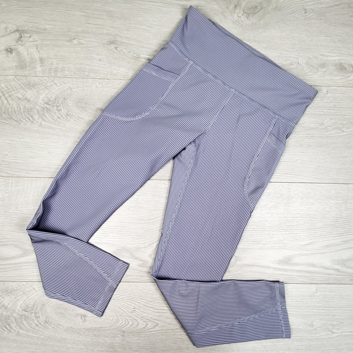 Old Navy purple striped active leggings. Size 8