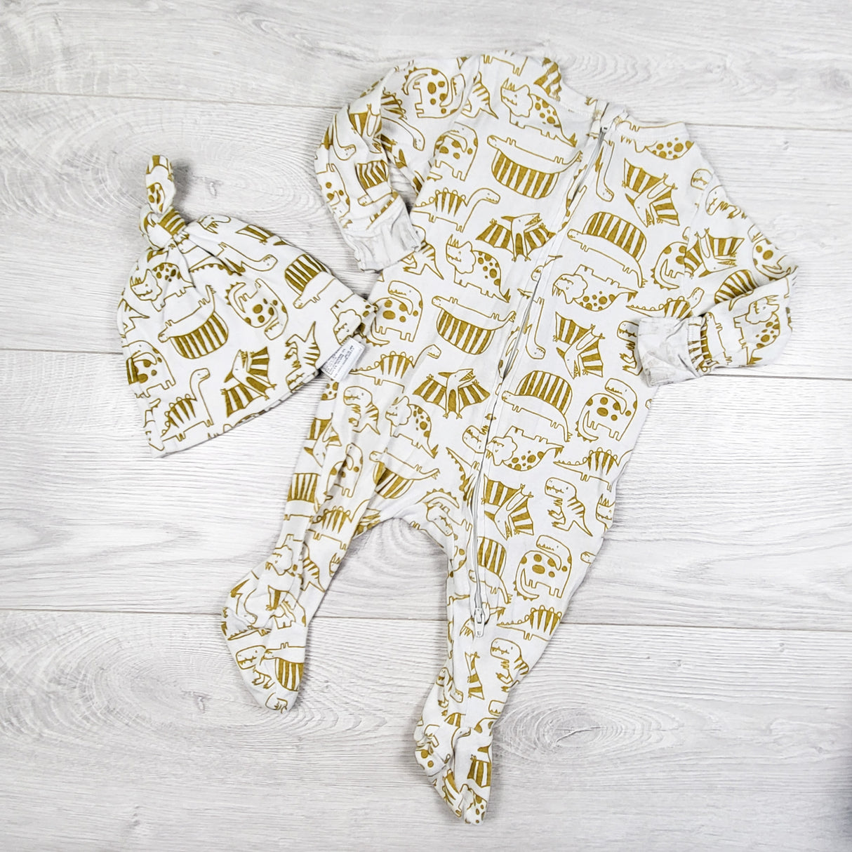 Old Navy white and gold dinosaur print sleeper + hat. Size 3-6 months