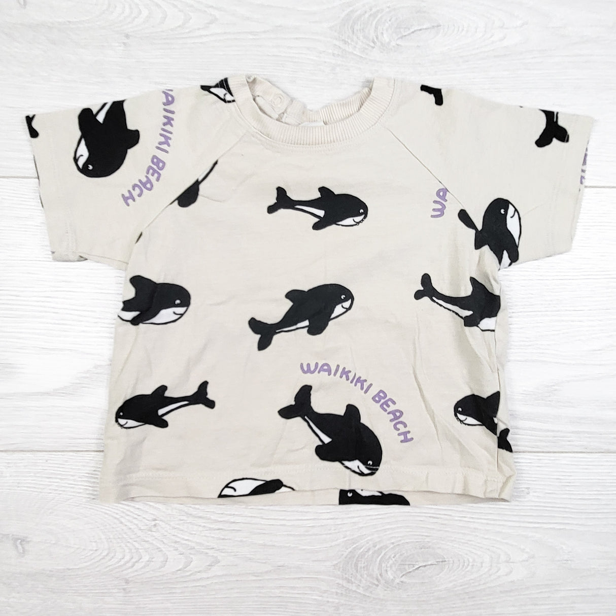 H and M beige orca print t-shirt. Size 6-9 months