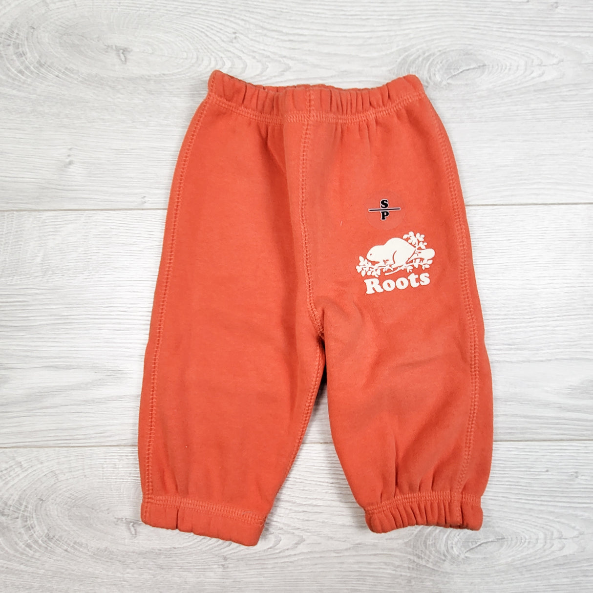 Roots coral sweat pants. Size 3-6 months