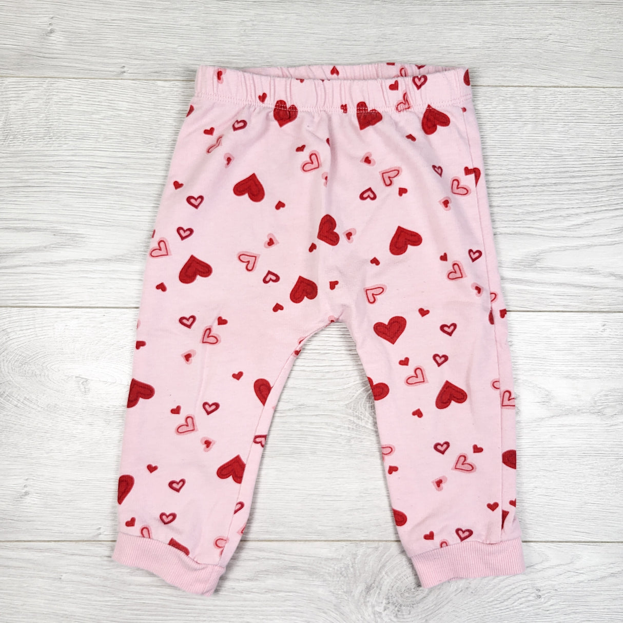 First Impressions pink heart print pants. Size 24 months