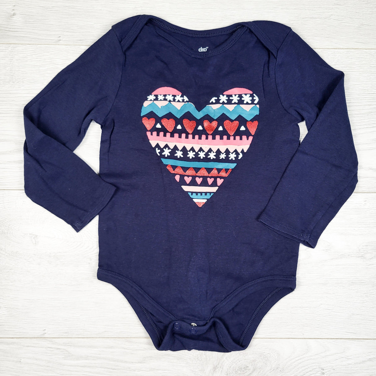 Dip navy bodysuit with patterned heart. Size 18-24 months