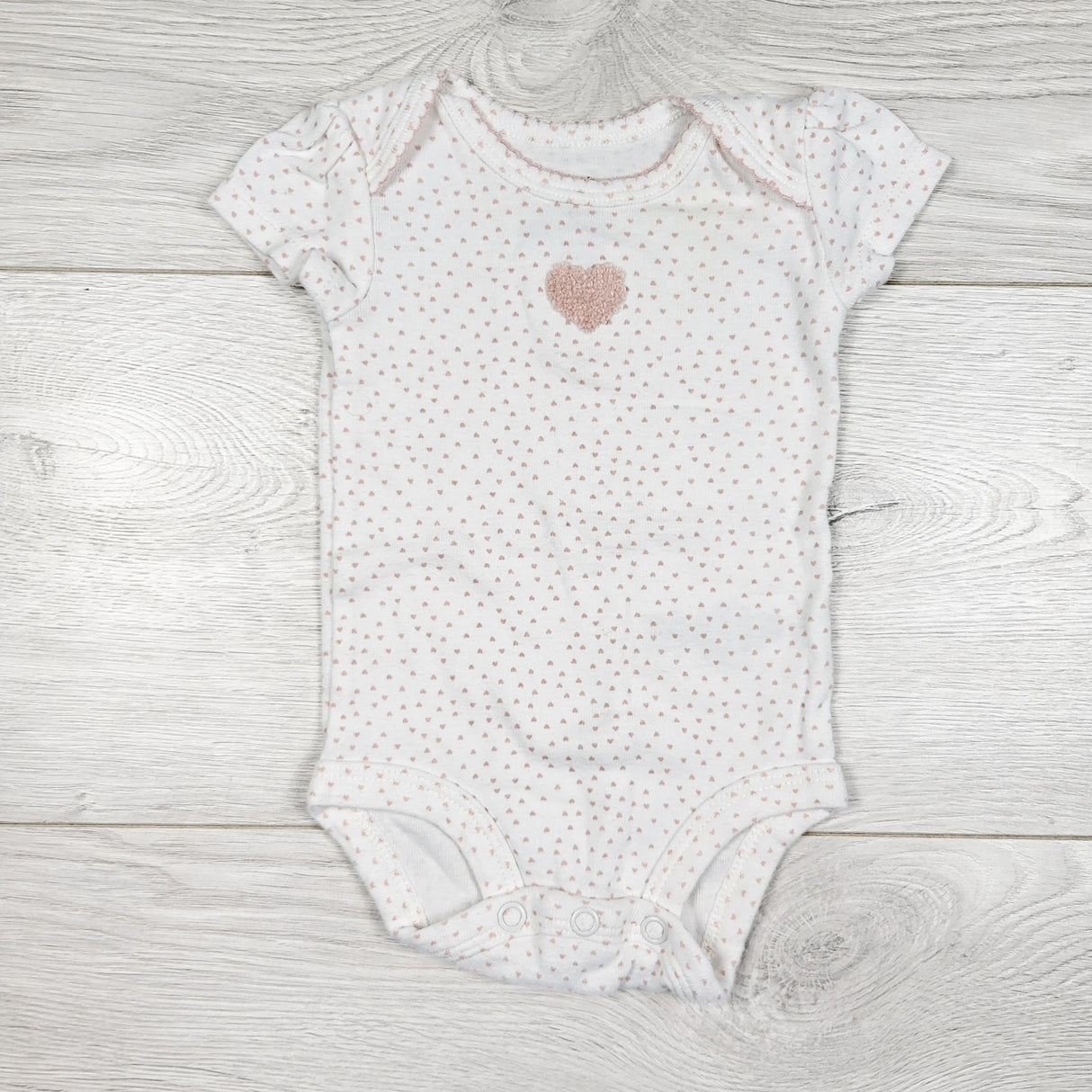 Carters white and pink bodysuit with chenille heart. Newborn size