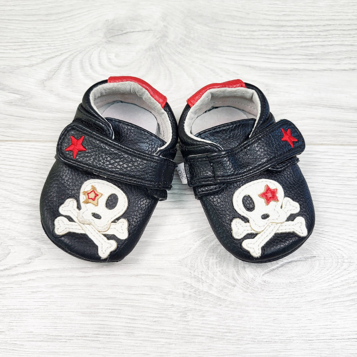 Jack and Lily black leather crossbones shoes. Size 0-6 months