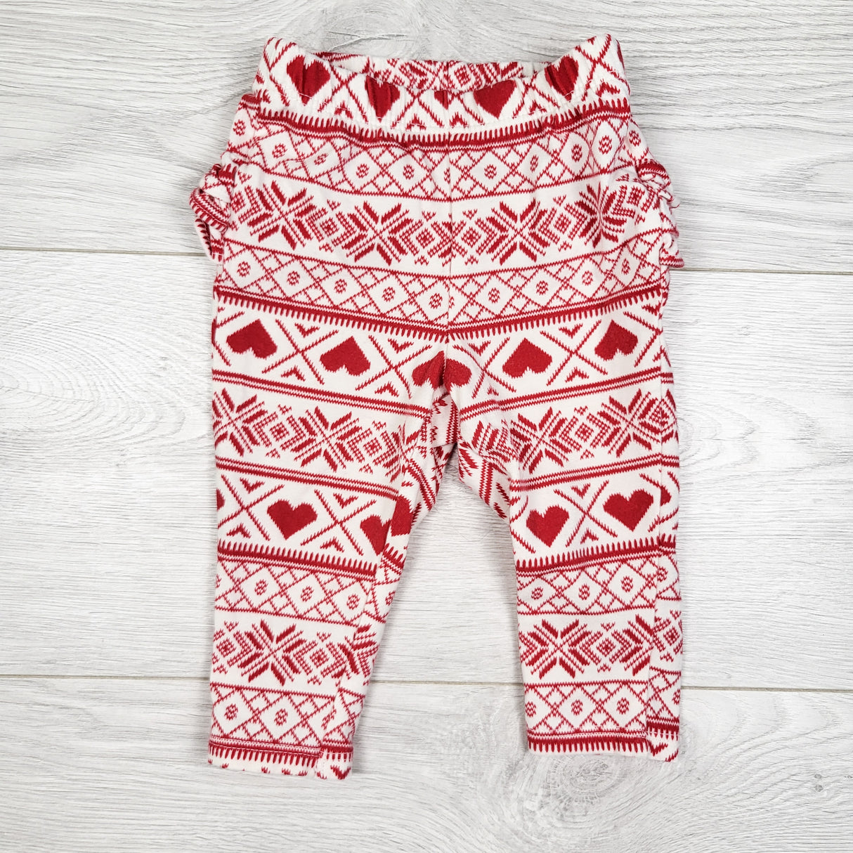 Old Navy red and white patterned ruffle bum leggings. Size 3-6 months