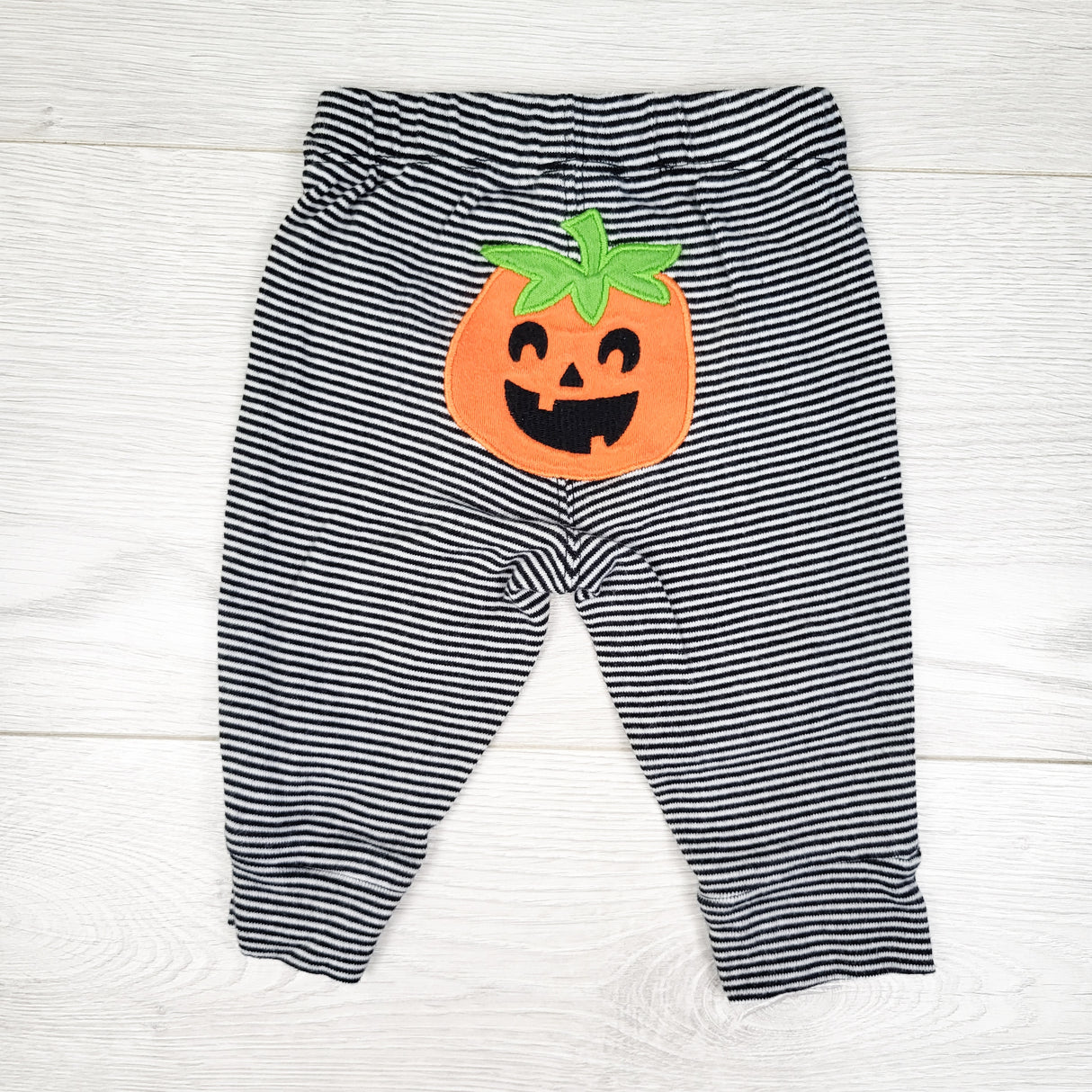 Carters striped leggings with jack-o-lantern. Size 3 months