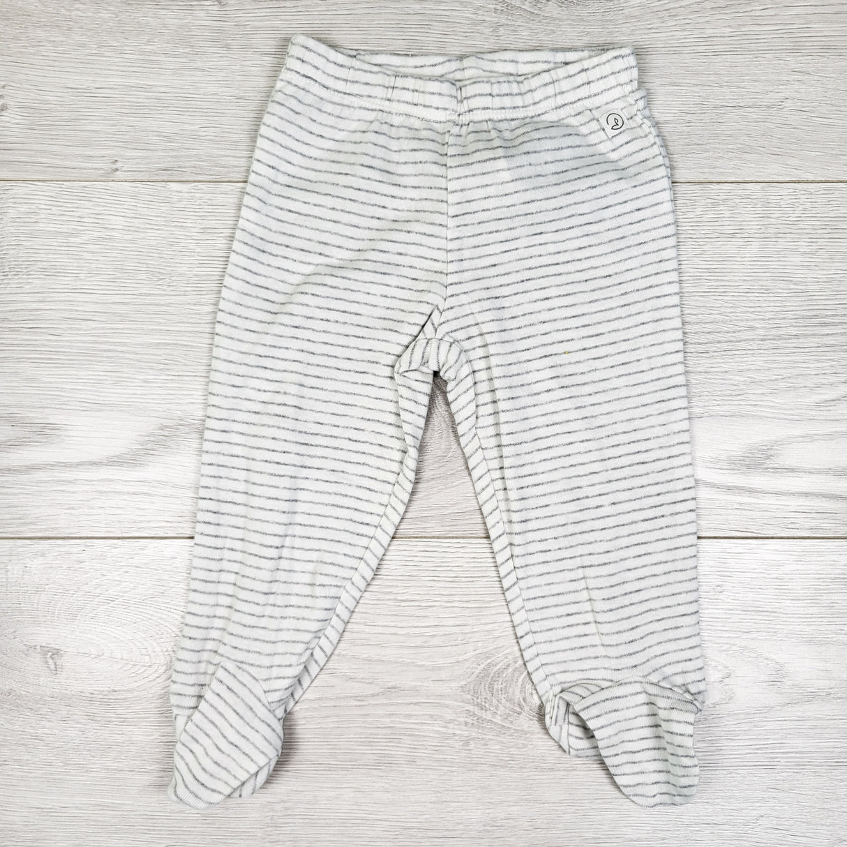 Little Planet white striped footed pants. Size 6 months