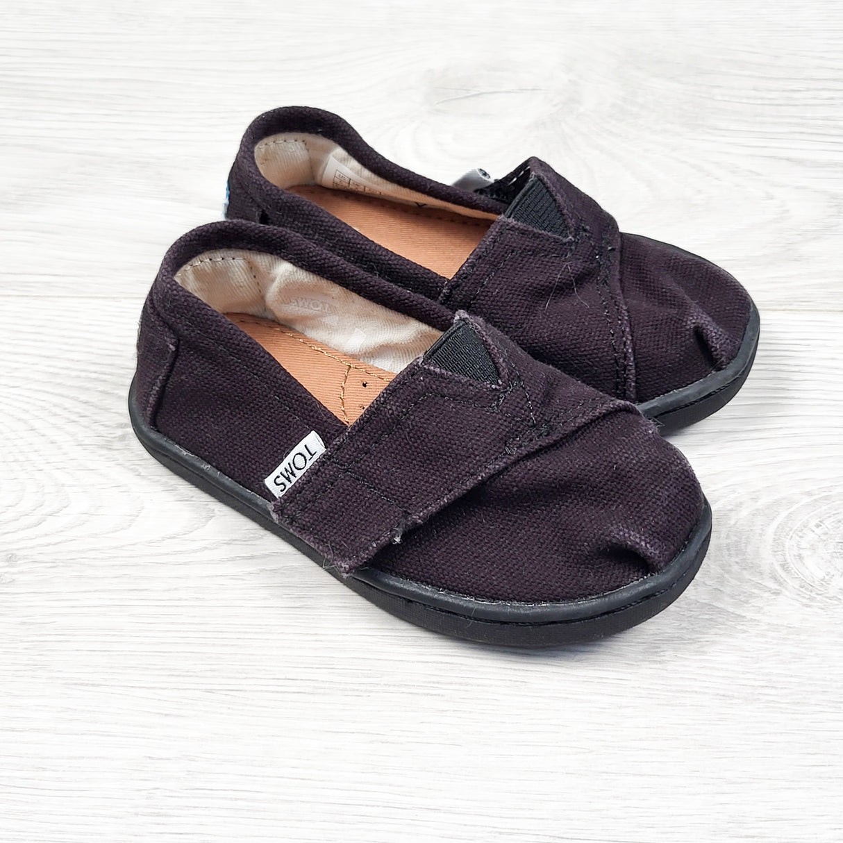 Toms black slip-on shoes. Size 5