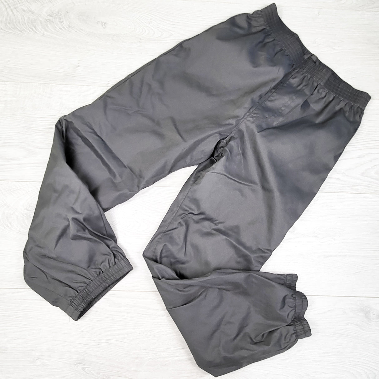 Grey jersey lined rain pants. Size 6/6X