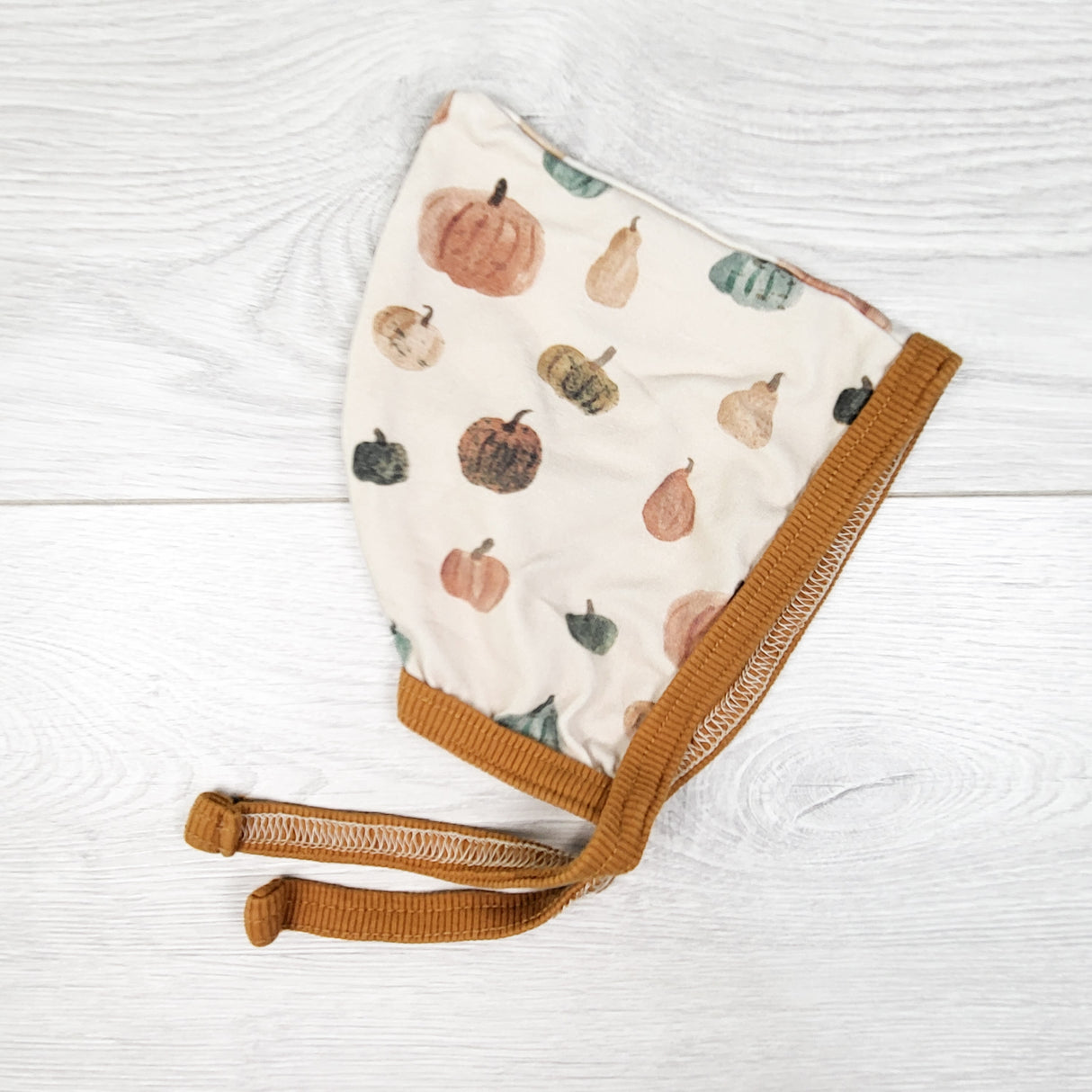 Teddy Little Apparel pumpkin print bonnet. Size 6-9 months
