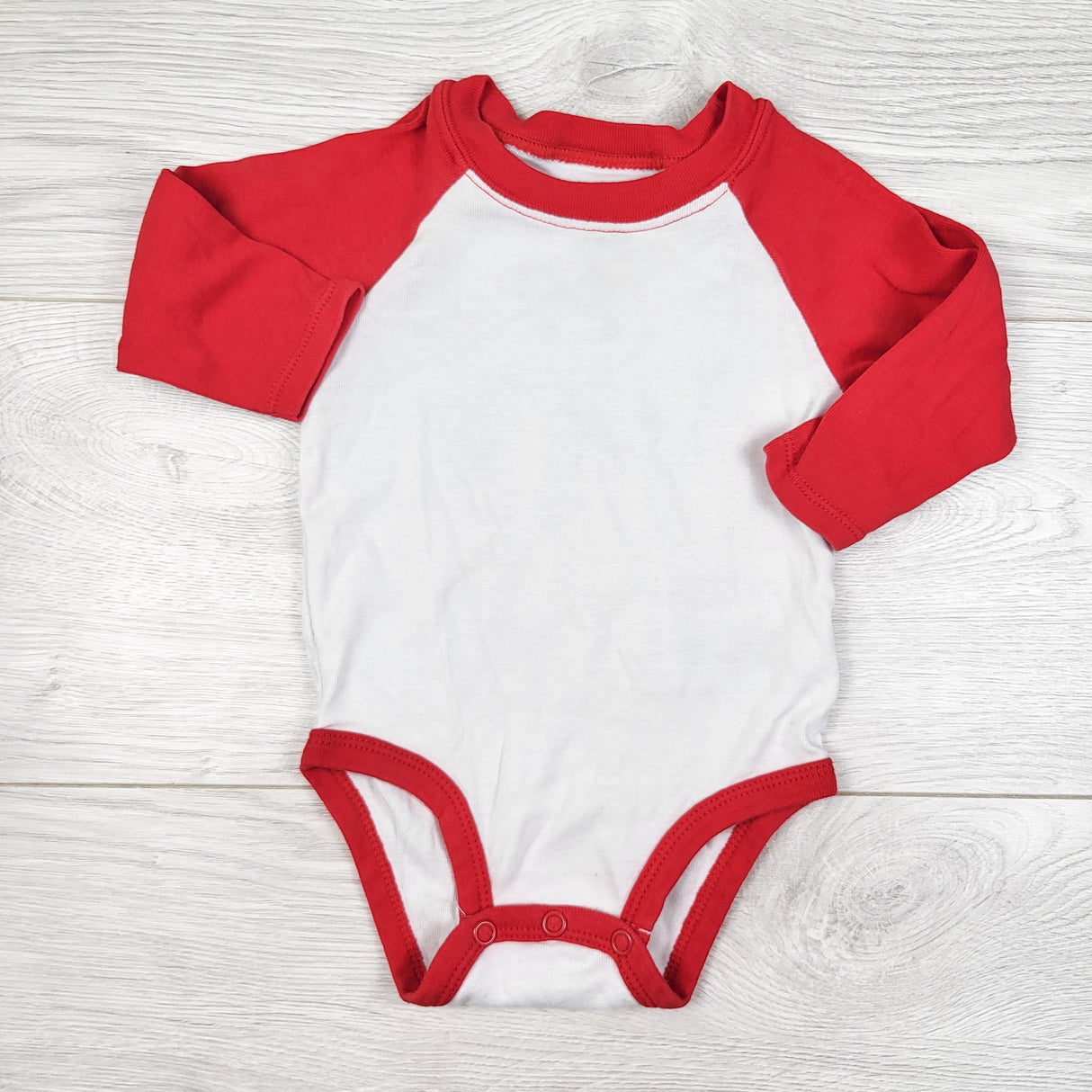 Carters white and red raglan style bodysuit. Size 6 months