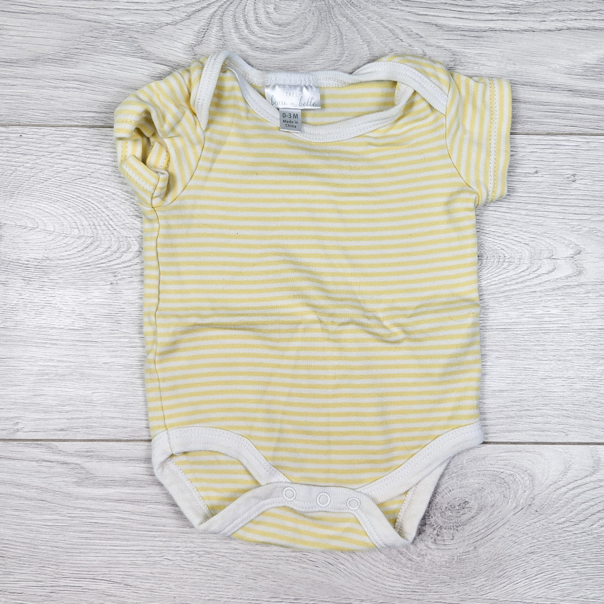 Tres Beau Belle yellow strieped bodysuit. Size 0-3 months