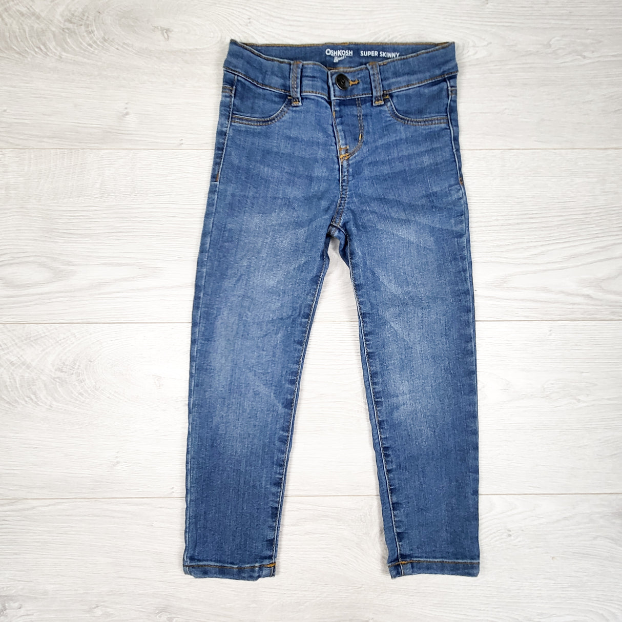 Oshkosh medium wash super skinny jeans. Size 4T