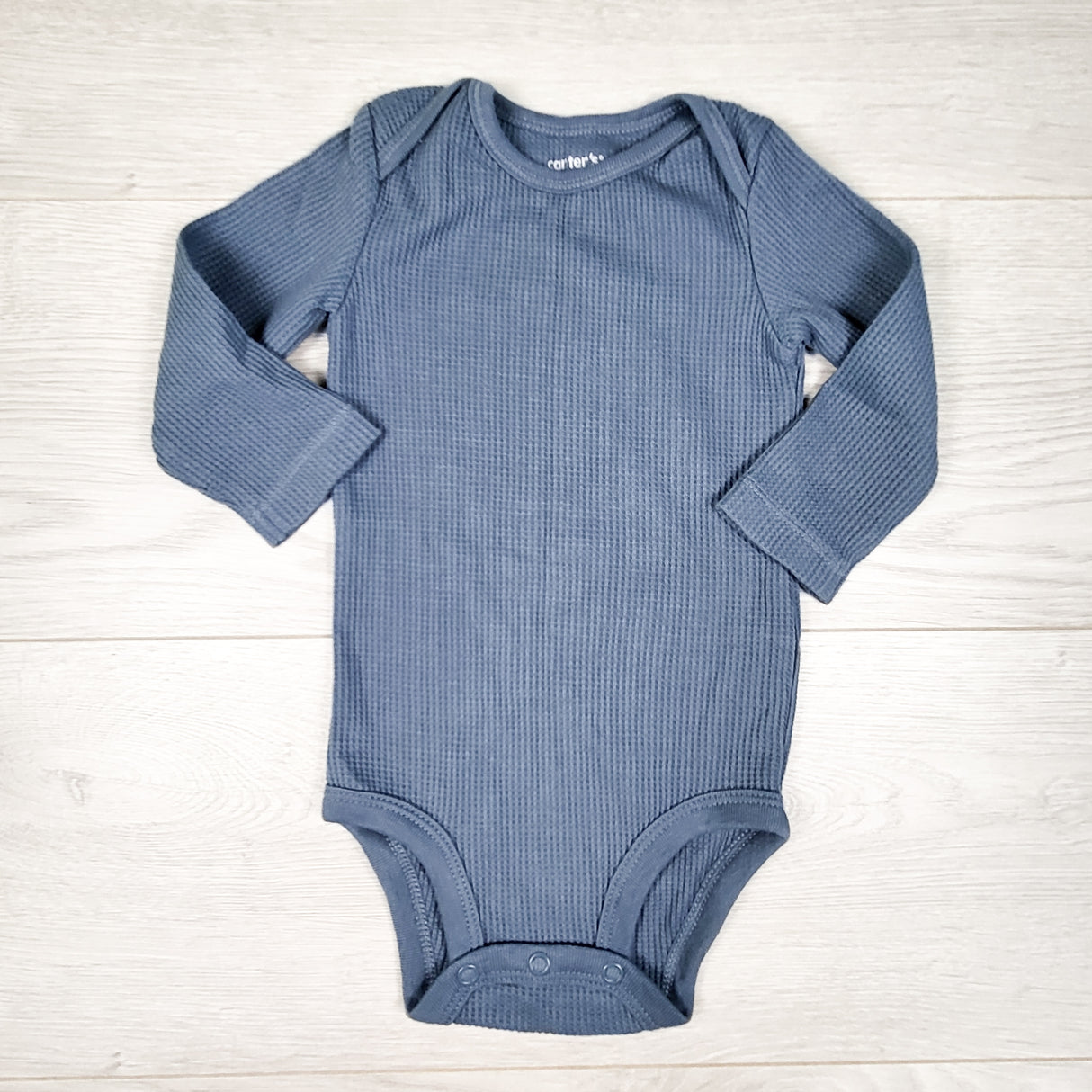 Carters blue waffle knit bodysuit. Size 6 months