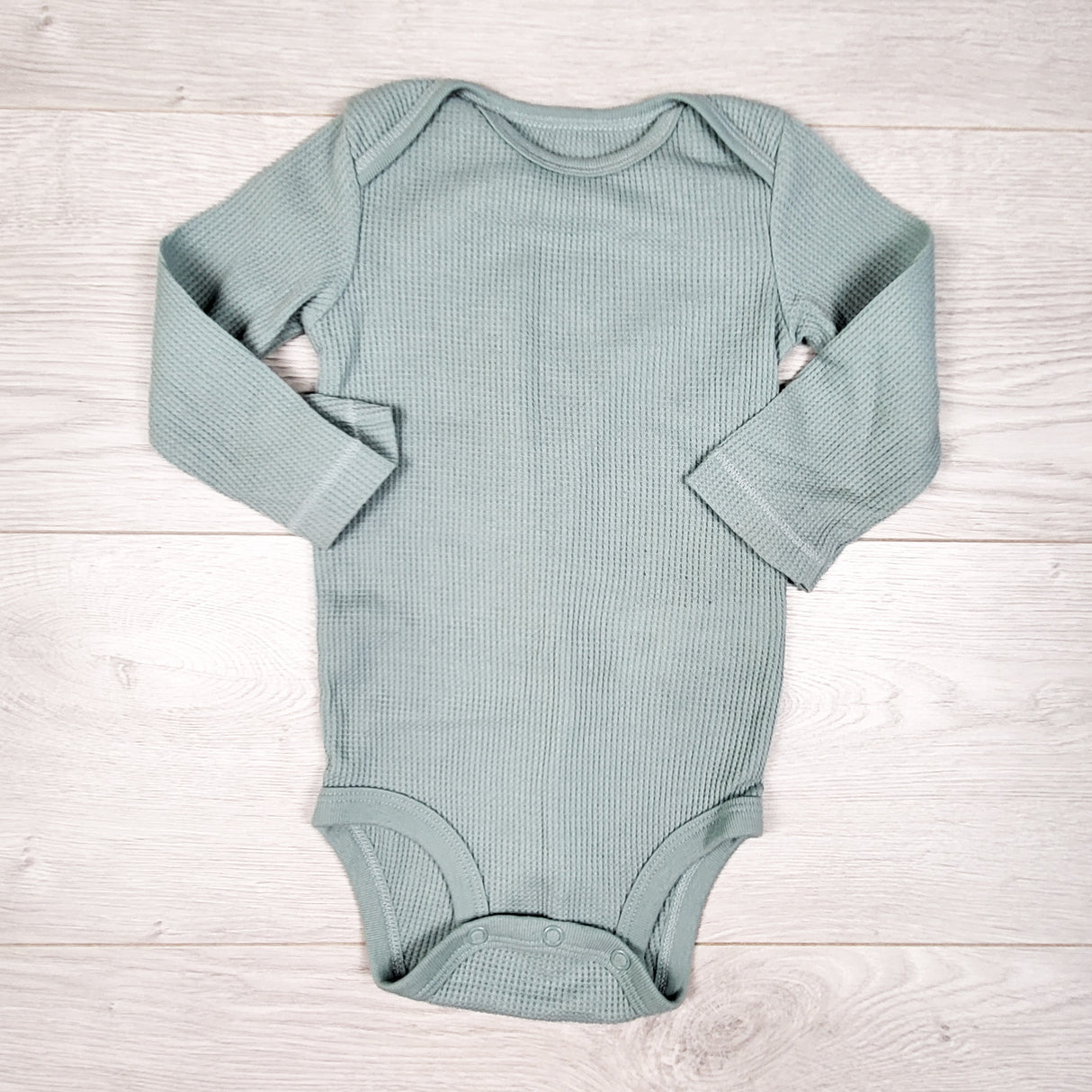 Carters aqua coloured waffle knit bodysuit. Size 12 months