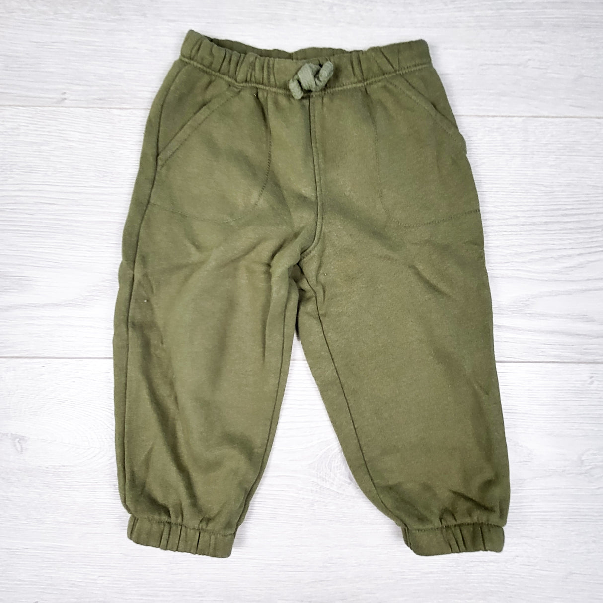 Carters green fleecy lined joggers. Size 9 months