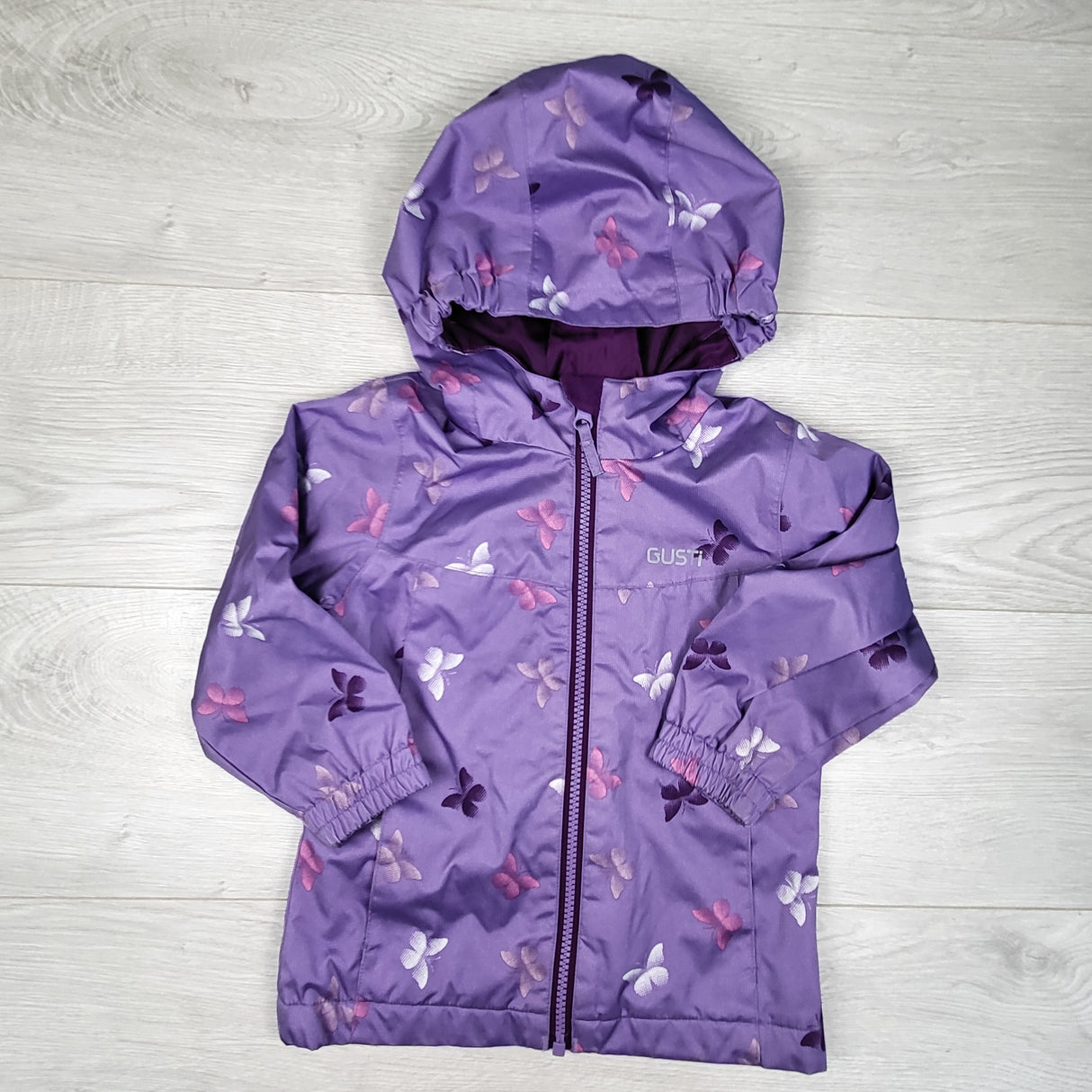 Gusti purple fleece lined rain jacket with butterflies. Size 3T
