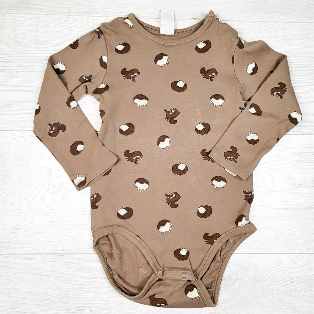 H and M brown bodysuit with hedgehogs. Size 2/3T