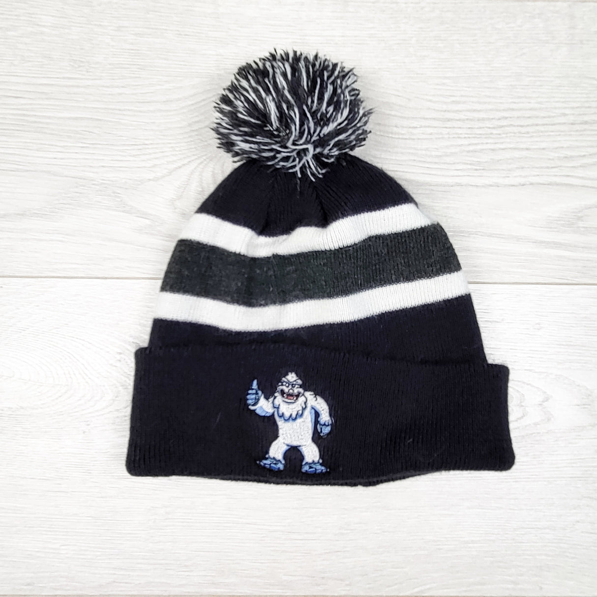 Pom pom toque with Yeti. One size fits all