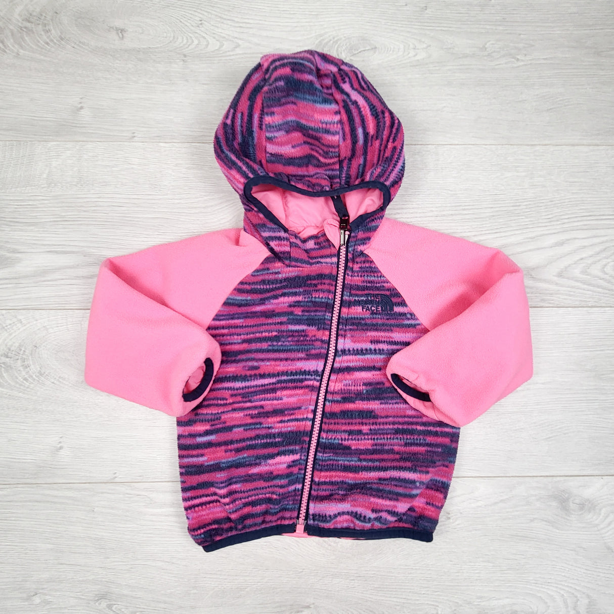 The North Face Infant Reversible Breezeway Wind Jacket. Sizes like 18 months
