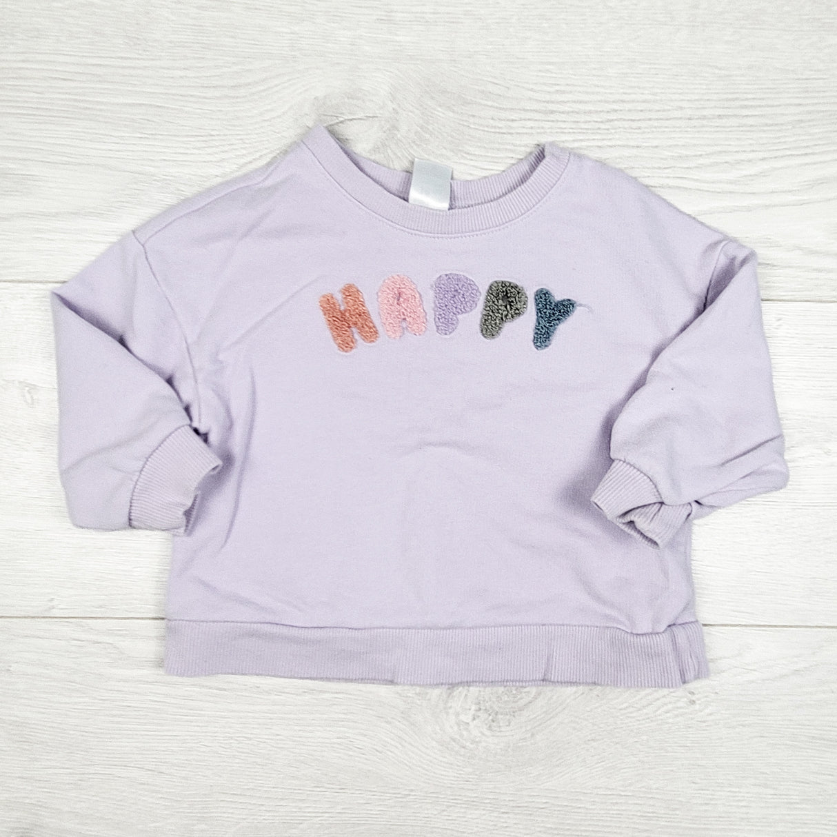 Carters purple "Happy" sweatshirt with chenille lettering. Size 18 months