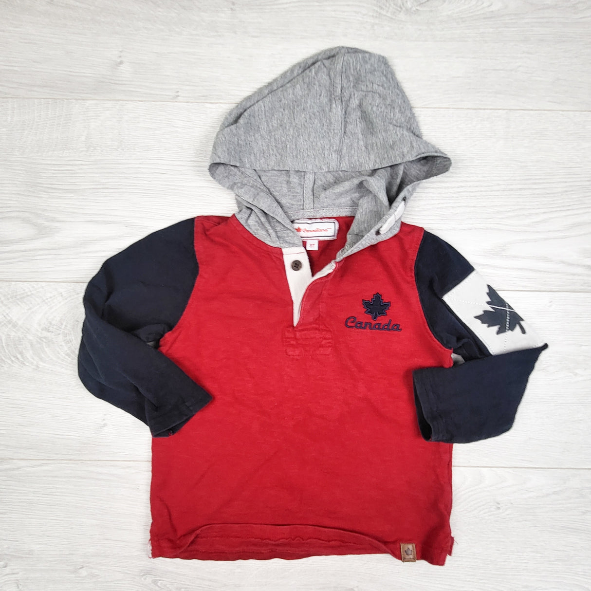 Canadiana red and navy hooded rugby style shirt. Size 3T