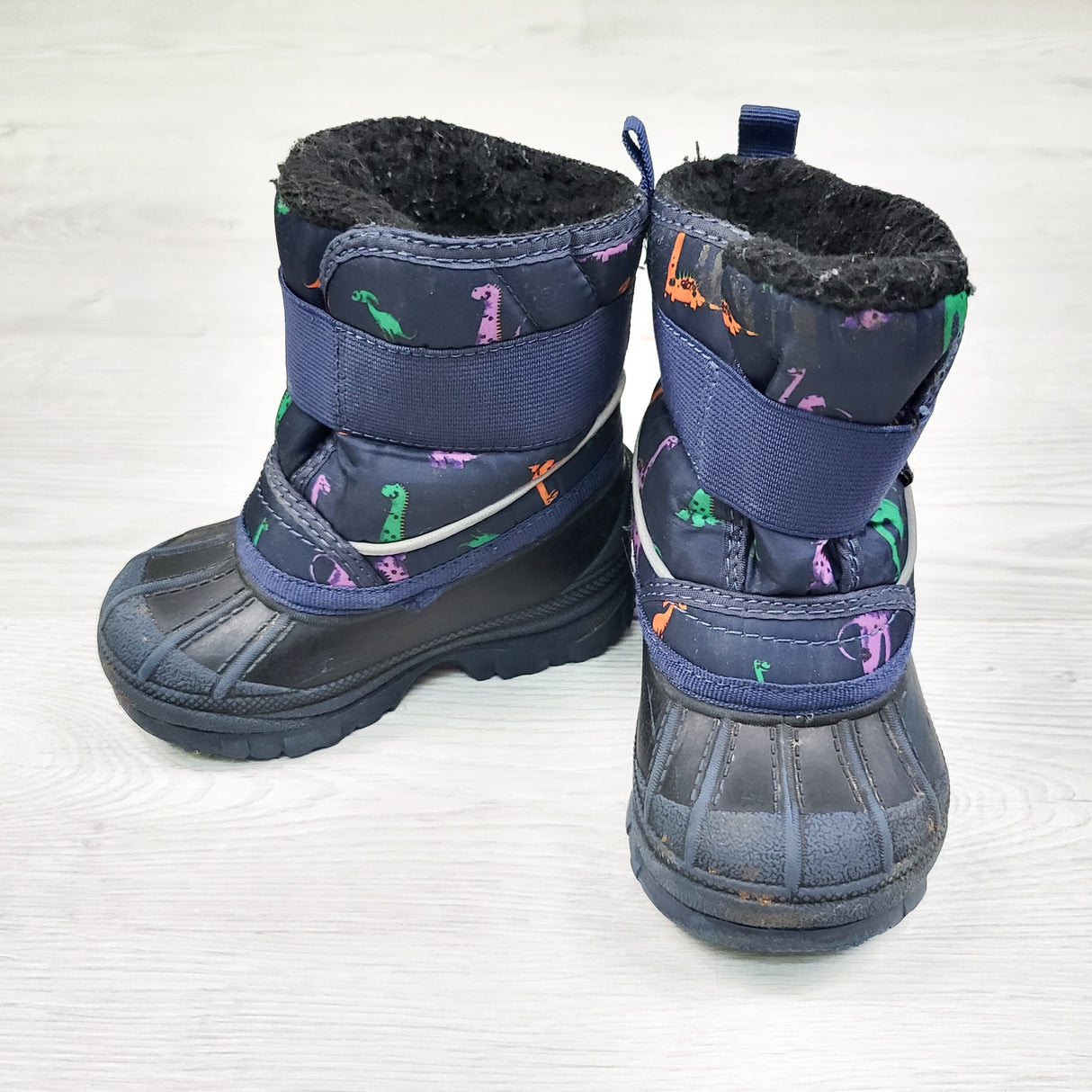 Rip Zone navy snow boot with dinosaurs. Size 6
