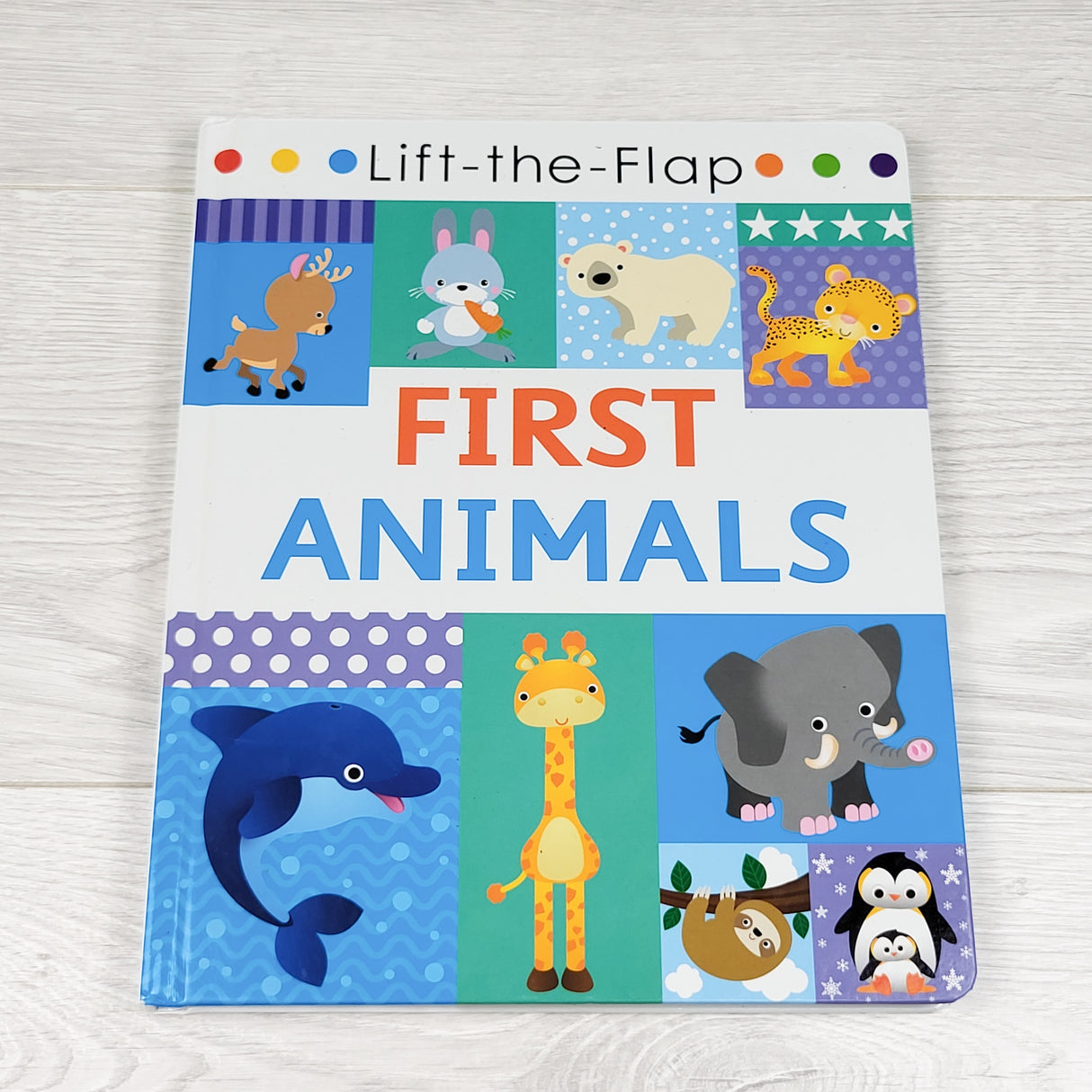 First Animals. Lift the flap board book (no shipping)