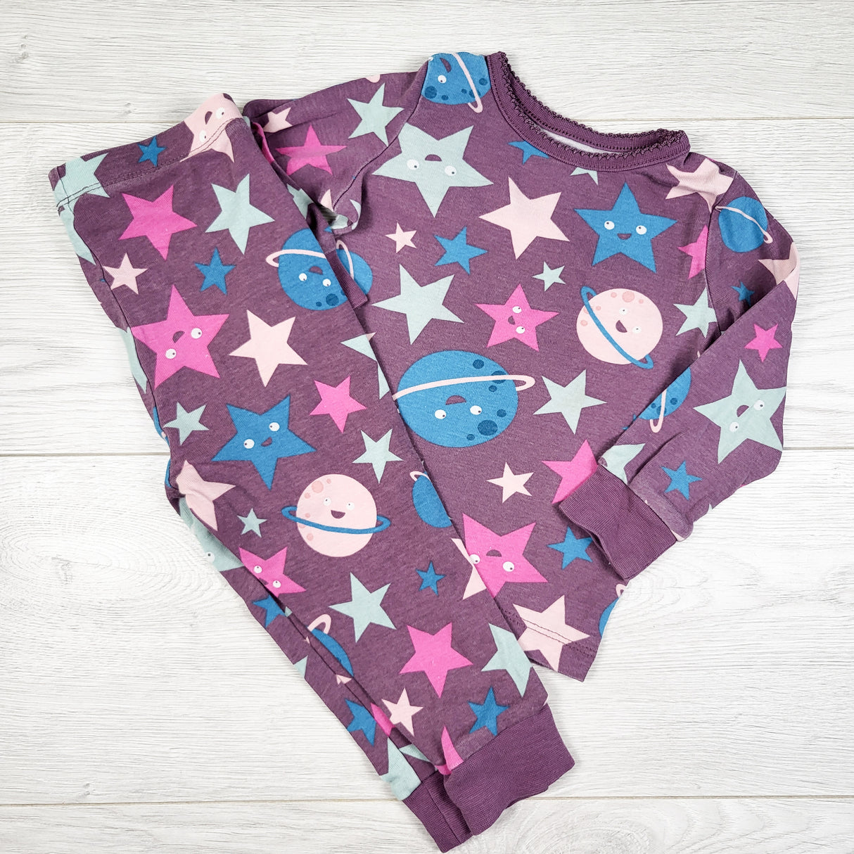 George purple 2pc PJs with stars and planets. Size 12-18 months