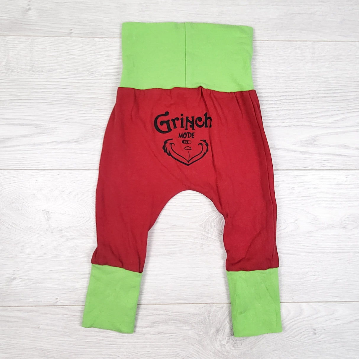 Coastal Edge Designs handmade "Grinch Mode On" pants. Approx 3-12 months