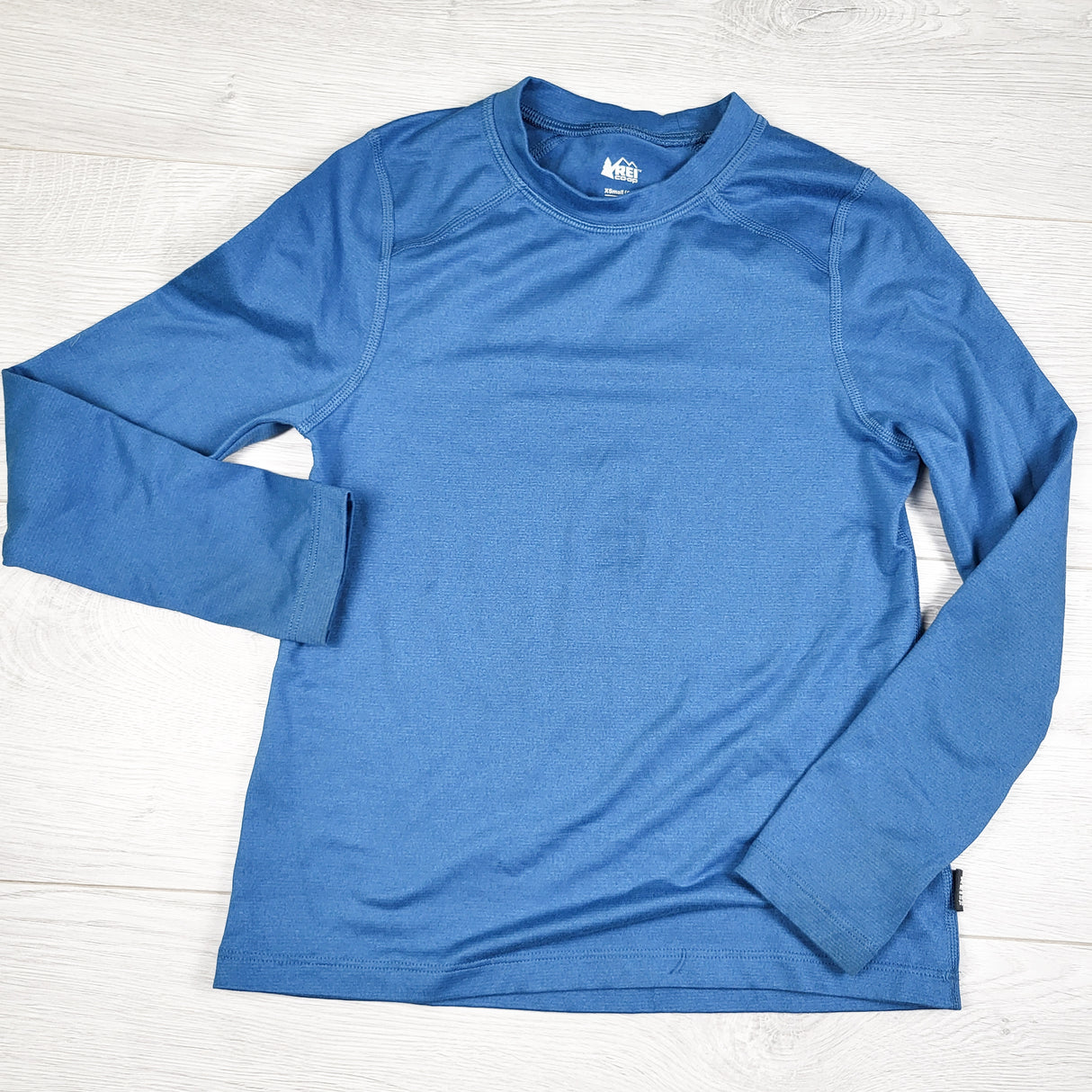 REI blue long sleeve midweight base layer shirt. Size 6/7 - AS IS