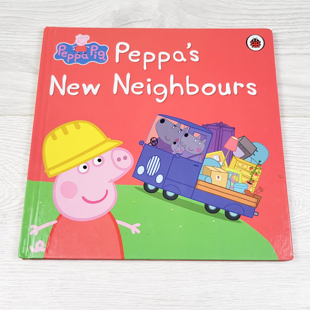 Peppa's New Neighbours. Hardcover book