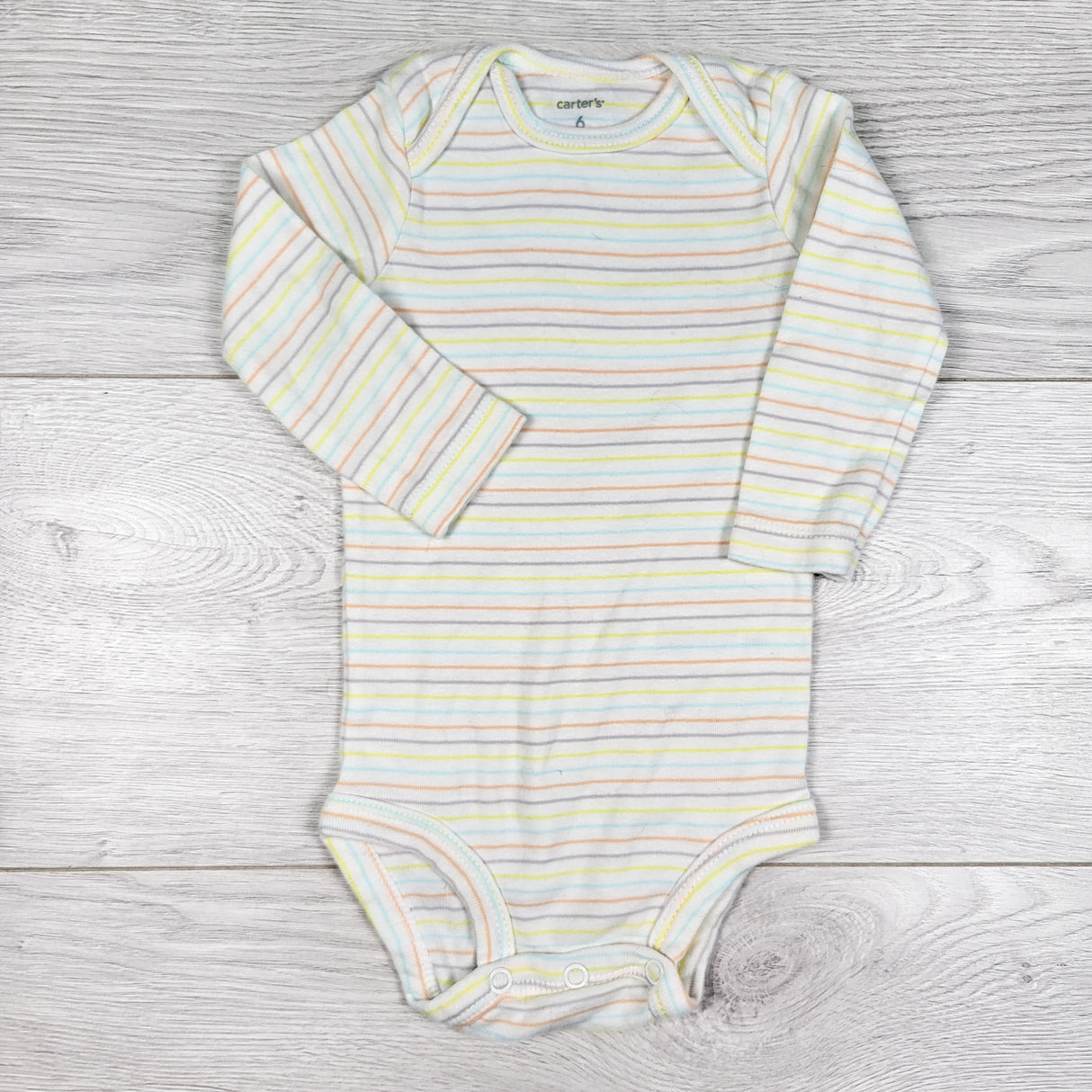 Carters white multi-striped bodysuit. Size 6 months