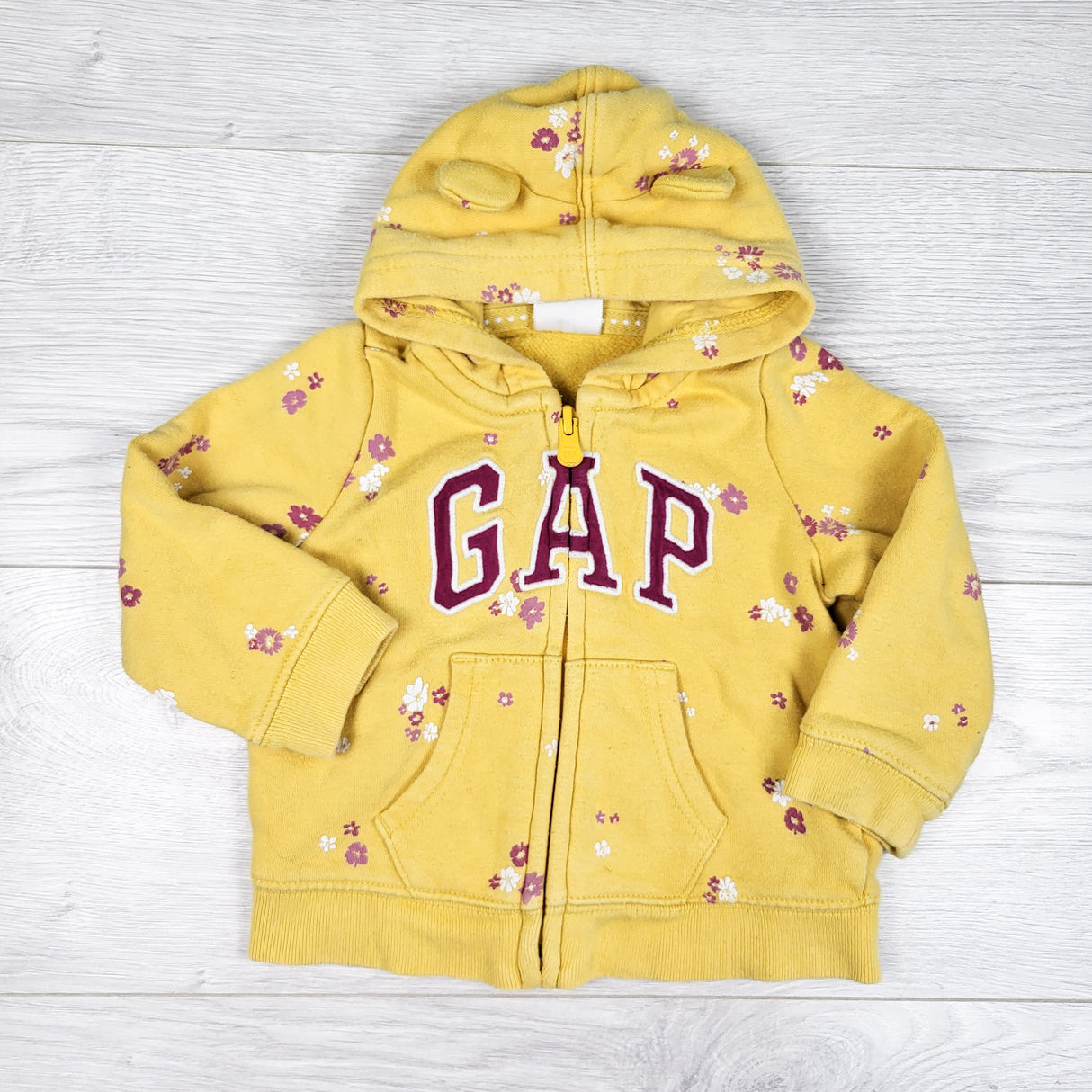 Gap yellow floral print zip up hoodie. Size 6-12 months
