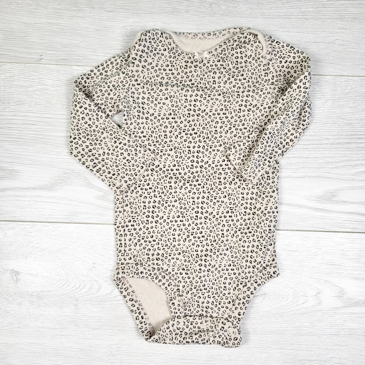 Carters beige leopard print bodysuit. Size 6 months