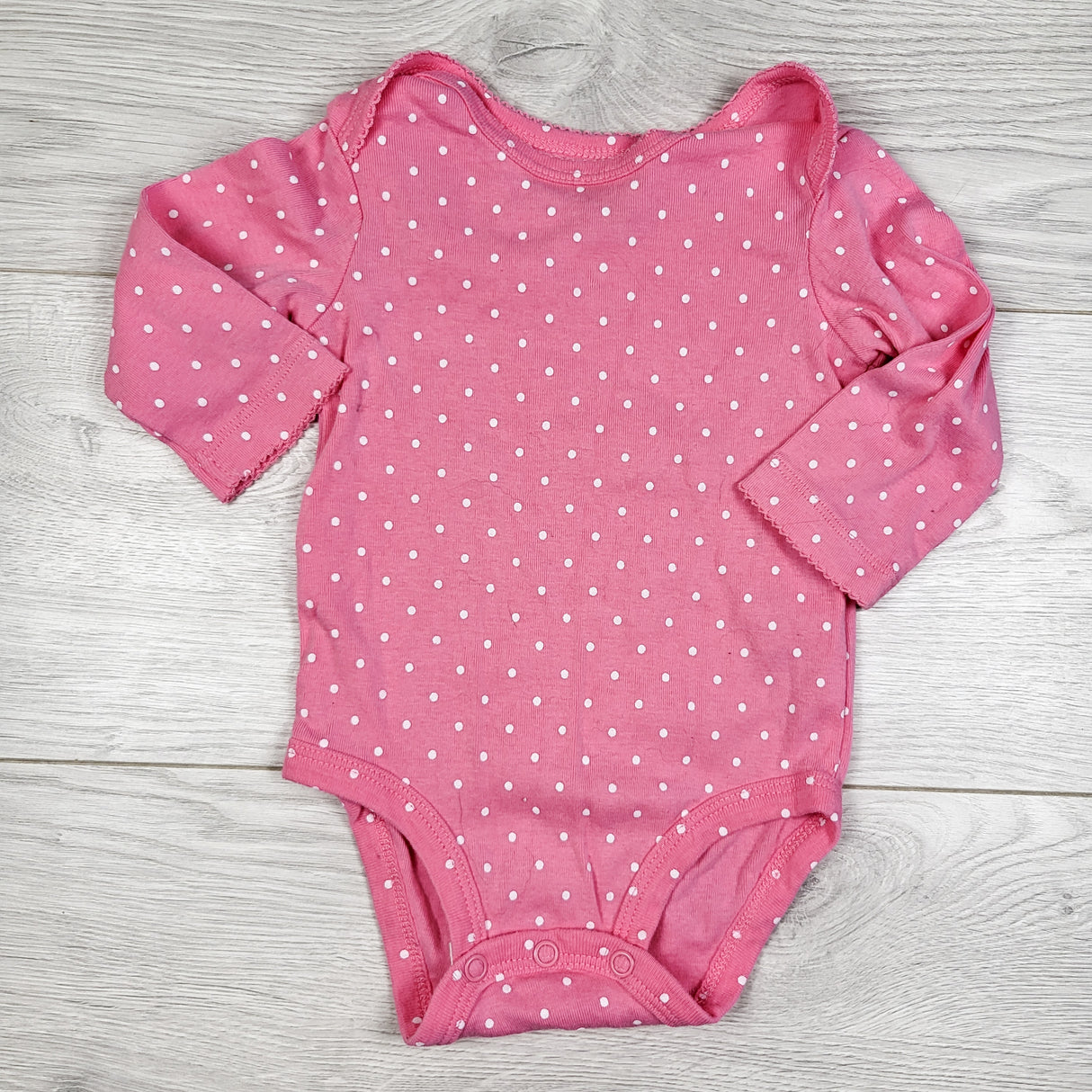 Carters pink polka dot bodysuit. Size 6 months