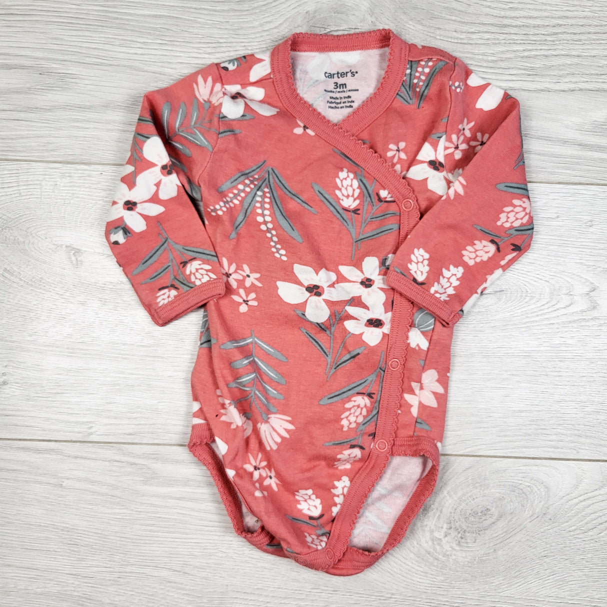 Carters pink floral print wrap style bodysuit. Size 3 months
