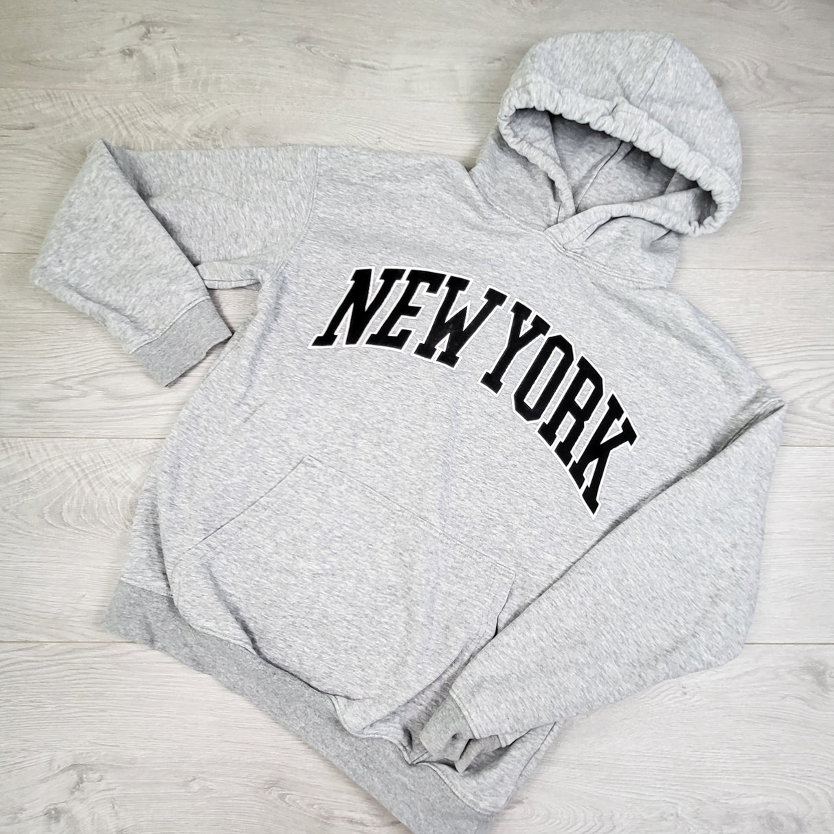 H and M grey pullover 'New York" hoodie. Size 12-14 Years