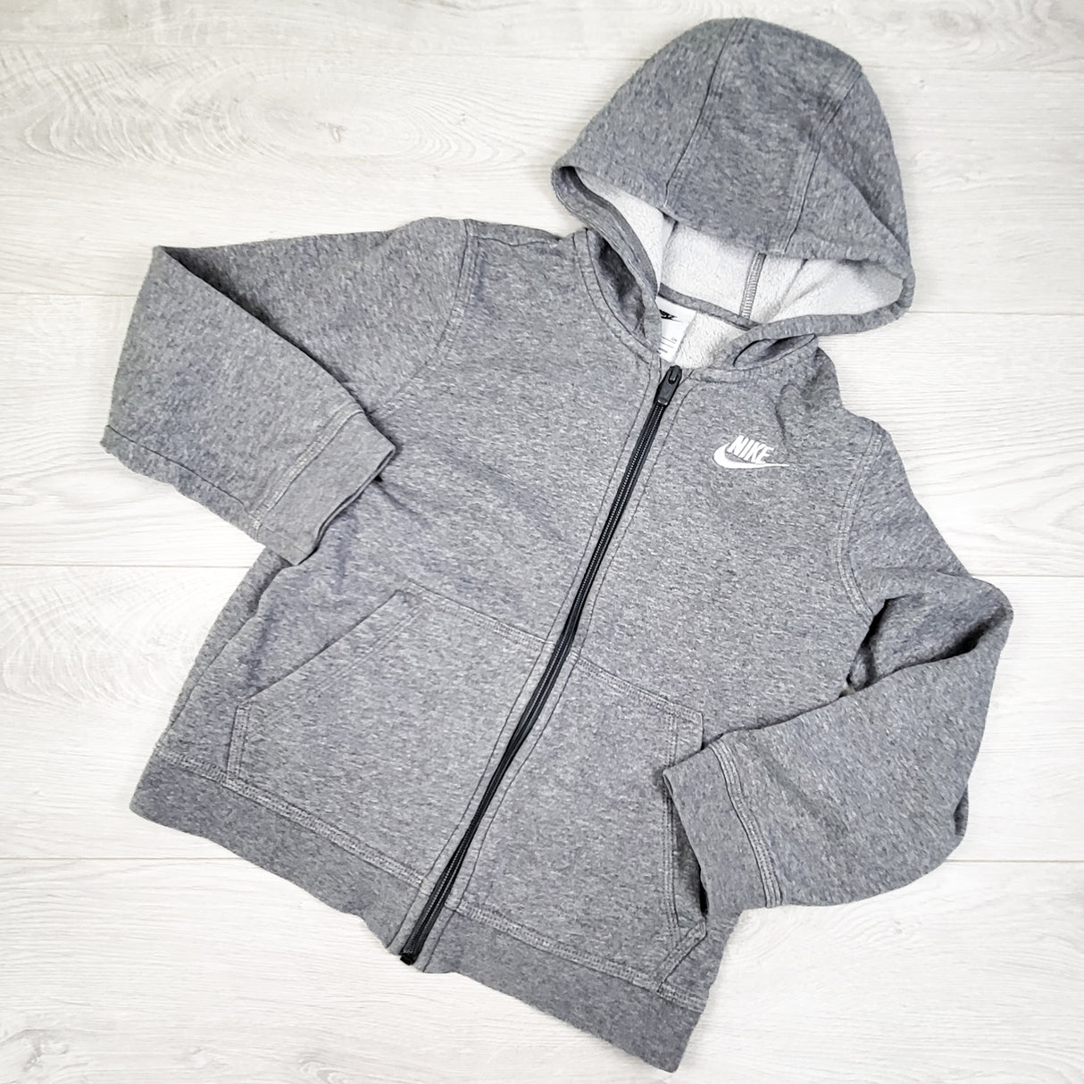 Nike grey fleecy lined zip up hoodie. Size small (8-10)