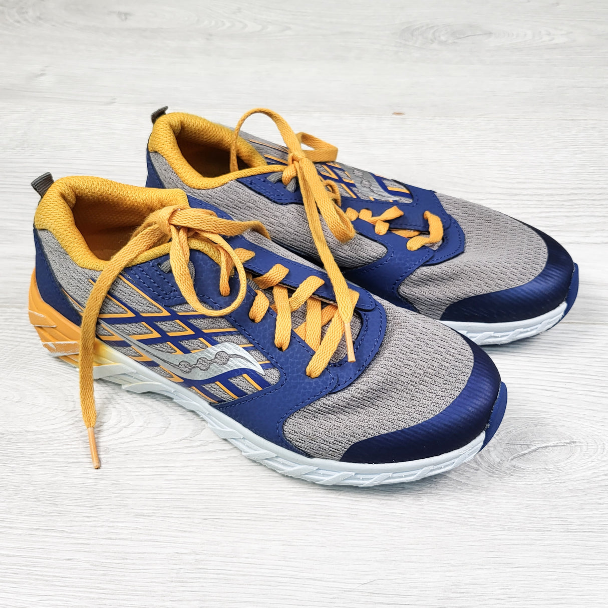 Saucony navy and orange running shoes. Youth size 4