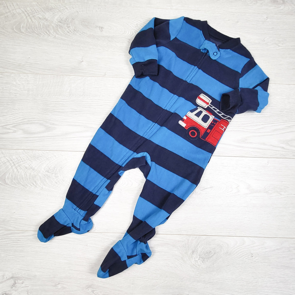 Carters blue and navy striped zippered fleece sleeper with fire truck. Size 9 months