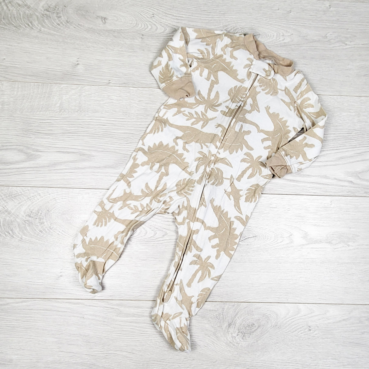 Carters white and beige dinosaur print zippered cotton sleeper. Size 6 months
