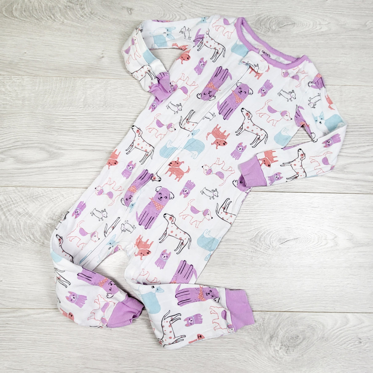 Carters white zippered cotton sleeper with dogs. Size 24 months