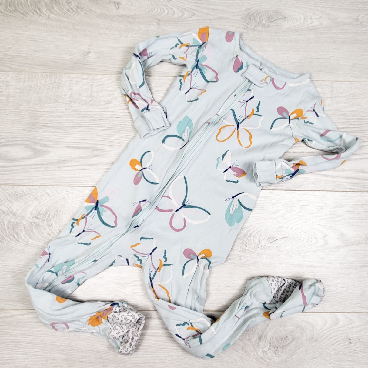 Carters light blue zippered cotton sleeper with butterflies. Size 24 months